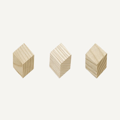 Lex Pott’s Iso Hooks are small geometric hooks that give the illusion of a cube rising from the wall. Made in ash wood and available in a range of different colours, they can be used to form a coat rack or to create a sculptural wall decoration.