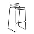 The absence of superfluous details in the Hee Bar Stool seems even more pronounced by its height and the presence of long slender legs. The ultimate in elemental design, this versatile bar/counter stool has a simple, uncluttered expression with excellent stability. Stackable and weather-proof, the Hee Bar Stool can be used in outdoor surroundings, as well as inside restaurants, bars and in the home.