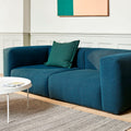 Rounded edges and soft cushions create a milder, relaxed tone with the Mags Soft Sofa. Retaining the same strong aesthetic presence as its firmer, more pared back sibling, this version takes on a more fluid, poetic silhouette. Optimal comfort and durability are ensured by the sofa’s solid construction, which has been built using durable, high-density foam and covered with down padding for extra softness.