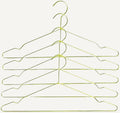 Hang is a minimalistic metal metal hanger that takes up less room in your closet, enabling you to store more clothes in the same amount of space. Made in wire, with different colour options.