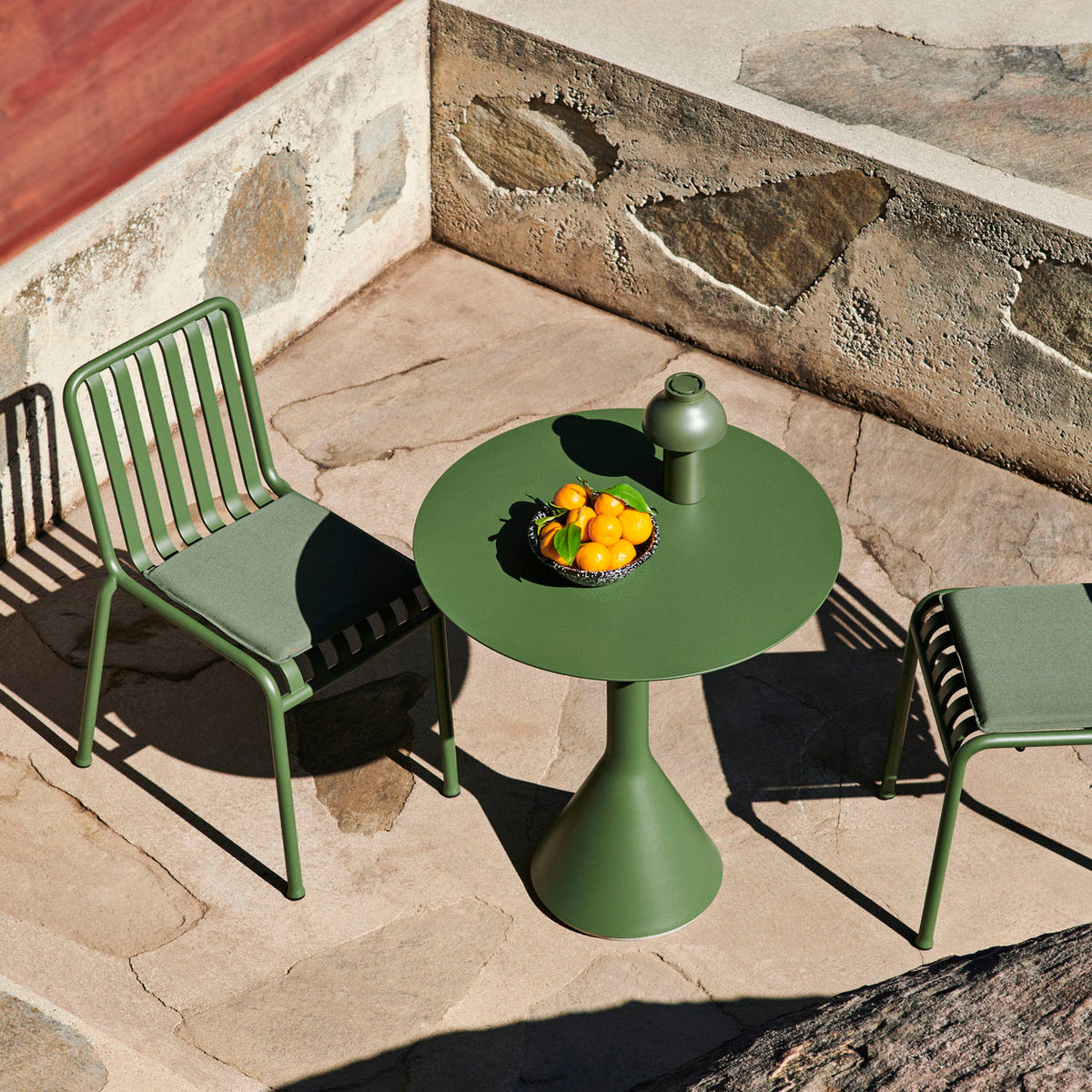 Based on the desire to develop a series of tables to complement the Palissade outdoor furniture collection, French design duo Ronan and Erwan Bouroullec teamed up with HAY to create the Cone Table. Its solid base and ultra-thin steel tabletop share the same graphic design idiom as the rest of the series, enabling the table to be strong without being bulky and elegant without being fragile.