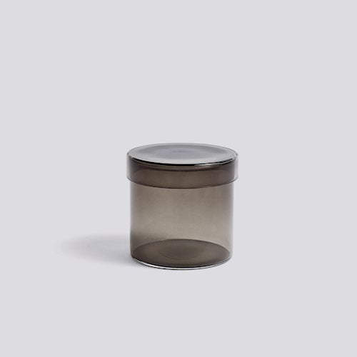 The HAY Container is a practical glass jar with matching lid designed for organizing and storing small items. Available in three sizes in many different tones of glass.