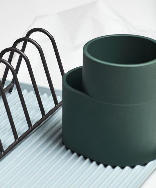 A trio of functional designs for draining the dishes, Shane Schneck’s Dish Drainer comprises a ridged melamine tray, steel plate rack and silicone cutlery holder. The contrasting shapes, materials and colours add visual interest to this everyday kitchen essential.