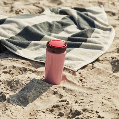 Contrasting colours make for a playful expression in George Sowden’s Travel Mug. Crafted in stainless steel with a plastic lid, the functional design is suitable for containing hot and cold drinks. 