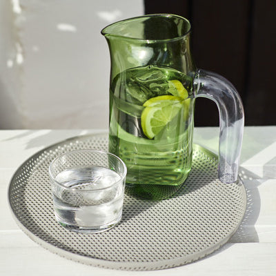 Expert glass artist Jochen Holz has created this glass Jug for HAY. The simple, organic design has a strong yet graceful expression, reinforced by the shaped rim and downward curve of the handle. Made from borosilicate glass so it is extra heat resistant. 
