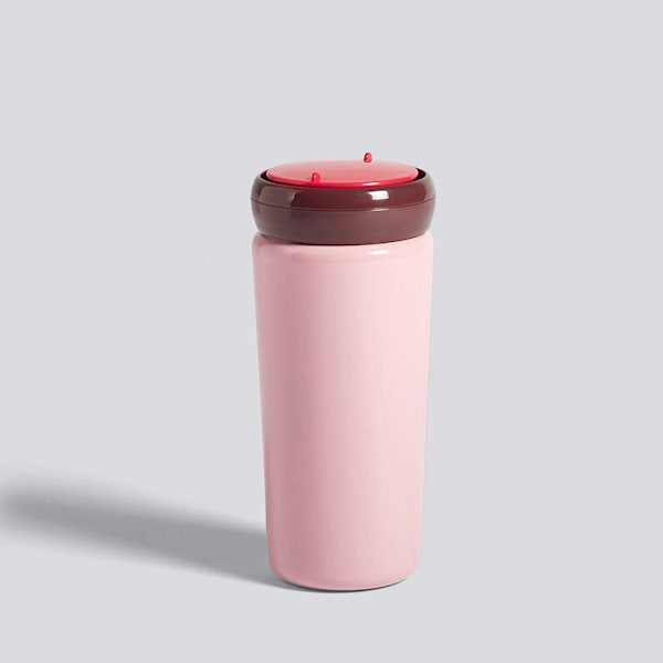 Contrasting colours make for a playful expression in George Sowden’s Travel Mug. Crafted in stainless steel with a plastic lid, the functional design is suitable for containing hot and cold drinks. 