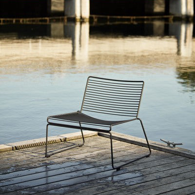 With its wide, welcoming seat and low height, Hee Lounge is definitely the most laid-back model in the Hee series. Although the elemental design is manifested here in more relaxed proportions, it still retains the same light, understated aesthetics and functional properties as the rest of the family. Stackable and weather-proof, the Hee Lounge Chair can be used in outdoor surroundings, as well as inside restaurants, bars and in a home environment.
