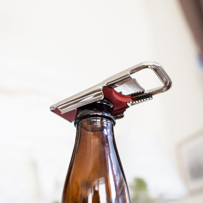 The Steel Bottle Opener and Resealer is made in polished steel with a rubber inlay to easily remove bottle tops or reseal them by sliding the rubber panel across. Made in Germany.