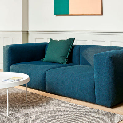 Rounded edges and soft cushions create a milder, relaxed tone with the Mags Soft Sofa. Retaining the same strong aesthetic presence as its firmer, more pared back sibling, this version takes on a more fluid, poetic silhouette. Optimal comfort and durability are ensured by the sofa’s solid construction, which has been built using durable, high-density foam and covered with down padding for extra softness. 