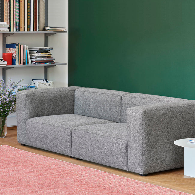 Rounded edges and soft cushions create a milder, relaxed tone with the Mags Soft Sofa. Retaining the same strong aesthetic presence as its firmer, more pared back sibling, this version takes on a more fluid, poetic silhouette. Optimal comfort and durability are ensured by the sofa’s solid construction, which has been built using durable, high-density foam and covered with down padding for extra softness. 