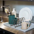 A trio of functional designs for draining the dishes, Shane Schneck’s Dish Drainer comprises a ridged melamine tray, steel plate rack and silicone cutlery holder. The contrasting shapes, materials and colours add visual interest to this everyday kitchen essential.