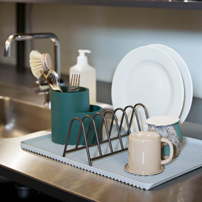 A trio of functional designs for draining the dishes, Shane Schneck’s Dish Drainer comprises a ridged melamine tray, steel plate rack and silicone cutlery holder. The contrasting shapes, materials and colours add visual interest to this everyday kitchen essential.