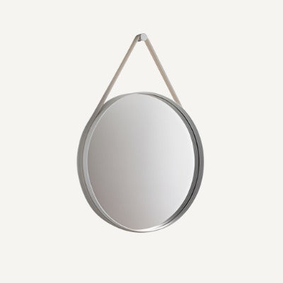 Based on the concept that restraint is best, Strap Mirror has kept the design stripped to a clean, circular shape. Strap features a groove around the edge to contain a sturdy rubber strap that is used to mount the mirror on the wall. With its functional and minimalistic design, Strap Mirror is perfect for hanging in bedrooms and halls and not suitable for wet rooms.