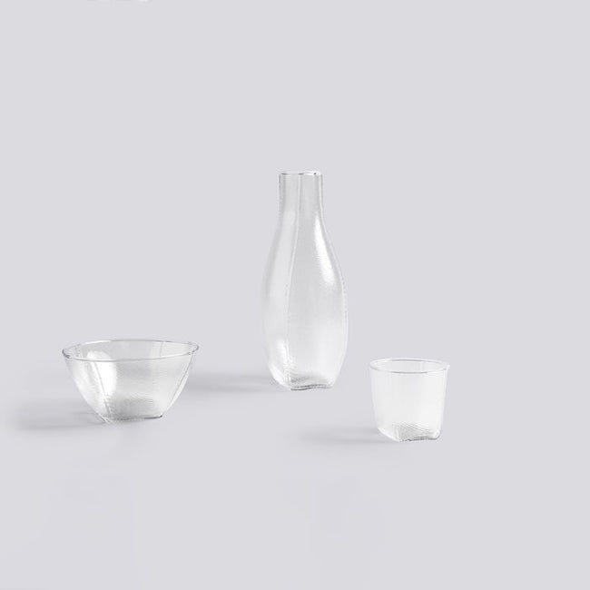 Tela Glassware was originally formed by experimenting with blowing molten glass into stitched textile bags. Light, strong and with beautiful detailing, the collection has a distinctive handmade character, yet is suitable for everyday use.